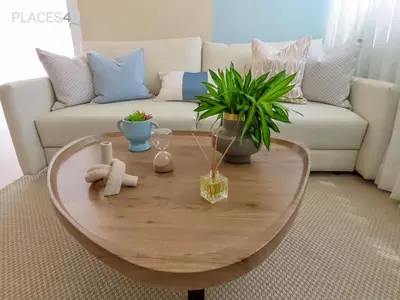 a coffee table in a living room with a couch at Hermoso apartamento 1 hab a pasos de la playa in Punta Cana