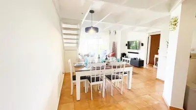 a dining room with a table and chairs at Cozy apartment Golf Course View in Punta Cana in Punta Cana