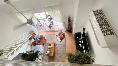 an overhead view of a living room with stairs at Cozy apartment Golf Course View in Punta Cana in Punta Cana
