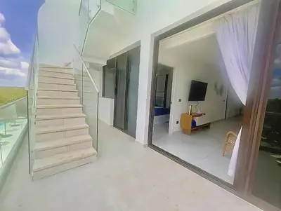 a staircase in a house with a mirror at Ph in Cana Rock Star With Golf View And Pool in Punta Cana