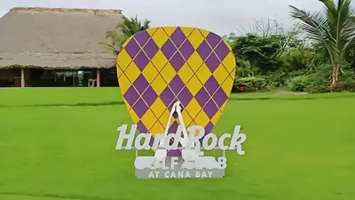 a sign for a hot air balloon at canaan bay at Ph in Cana Rock Star With Golf View And Pool in Punta Cana
