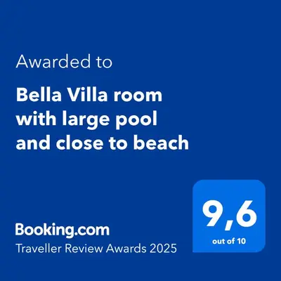 a screenshot of a cell phone with the text awarded to bellia villa room at Bella Villa room with large pool and close to beach in Las Galeras