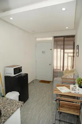 a living room with a couch and a table at APARTAMENTOS DE 1 2 Y 3 HABITACIONEs in Santiago de los Caballeros