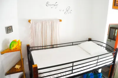 a bedroom with a bunk bed in a room at Casa Delfin Guest House in Las Terrenas