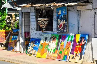 a store with paintings on display in front of it at Casa Delfin Guest House in Las Terrenas