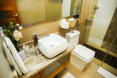 a bathroom with a sink and a toilet at RIBERAMAR Las Terrenas, Samana in Las Terrenas