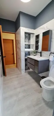 a bathroom with a toilet and a sink at Apartament central frente al mar in San Felipe de Puerto Plata