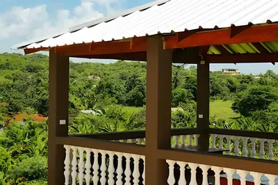 a view from the balcony of a house with a white roof at Apart hotel Costa Verde,#1 Exclusivo y seguro con cama Queen in Las Galeras
