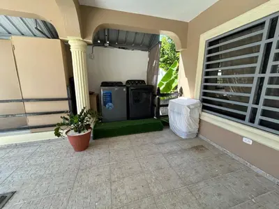 a front porch of a house with a stove at MB Apartment - B in San Felipe de Puerto Plata
