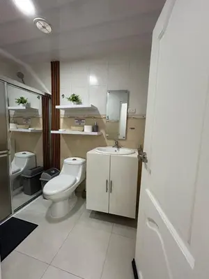 a small bathroom with a toilet and a sink at MB Apartment - B in San Felipe de Puerto Plata