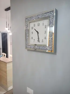 a clock on a wall in a room at Confortable apto. en Boca Chica in Boca Chica