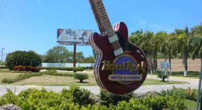 a large guitar shaped sign in a park at Hard Rock Punta Cana Luxe Apartment 2BR Coral Bay by BTC Crypto Group in Punta Cana