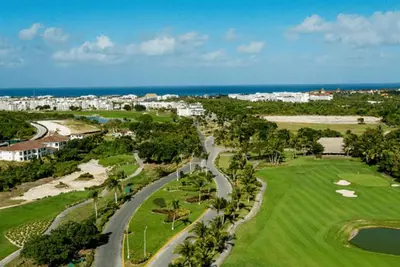 an aerial view of a golf course near the ocean at Hard Rock Punta Cana Luxe Apartment 2BR Coral Bay by BTC Crypto Group in Punta Cana