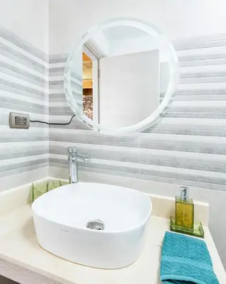 a bathroom with a white sink and a mirror at Paradise Dream Dominicus in La Laguna