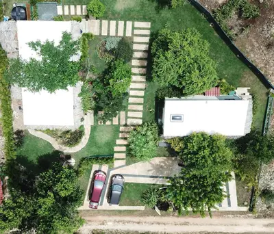 an aerial view of a yard with parked cars at CASAS LEON Casita de playa #2 in Santa Bárbara de Samaná