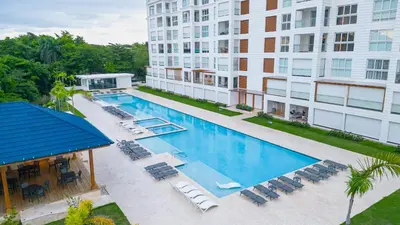 an overhead view of a swimming pool at a hotel at Fortunity Beach Tower-2 BDR with pool view in San Felipe de Puerto Plata
