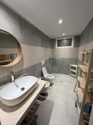 a bathroom with a sink and a toilet and a mirror at Komfortowy Apartament z 4 Basenami i Pięknym Ogrodem, Estrella Dominicus-Bayahibe in Bayahibe
