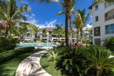 a view of a resort with palm trees and a swimming pool at Star of Caribbean- Estrella Dominicus Bayahibe in Bayahibe