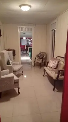 a living room with couches and chairs in a room at Classic House, Modern Spaces in Baní