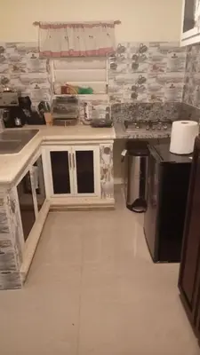 a kitchen with a sink and a counter top at Classic House, Modern Spaces in Baní