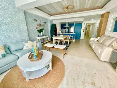 a living room with a couch and a table at Enjoy beach life at this gated in Juan Pedro