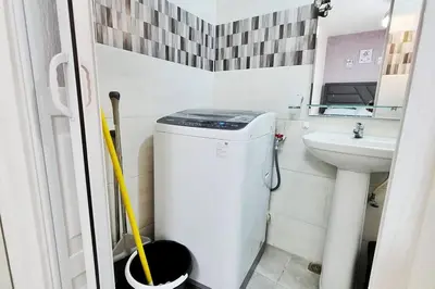 a small bathroom with a toilet and a sink at Apartamento acogedor Ashmi in Santiago de los Caballeros