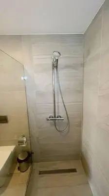 a shower stall in a bathroom with a toilet at Beautiful Penthouse with private elevator in Hard Rock Golf in Punta Cana