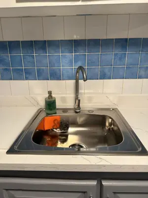 a sink with a faucet in a kitchen at EL TOUCAN, Apartament in bayahibe in Bayahibe