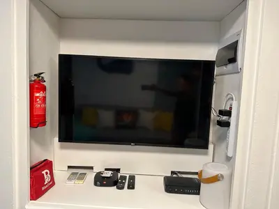 a flat screen tv on the wall of a room at EL TOUCAN, Apartament in bayahibe in Bayahibe