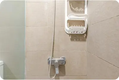 a shower in a bathroom with a shower head at Condo Apartment in Ciudad Nueva