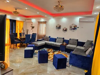 a living room with a couch and a table at Villa Selina in Punta Cana
