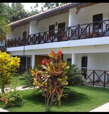 a building with a balcony on top of it at Hotel Piedra Marron in Las Terrenas