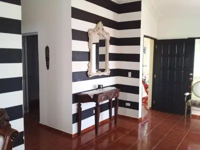 a bathroom with a sink and a mirror on a wall at The Beauty of samana in Santa Bárbara de Samaná