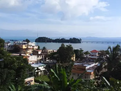 a view of a city and a bridge over the water at The Beauty of samana in Santa Bárbara de Samaná