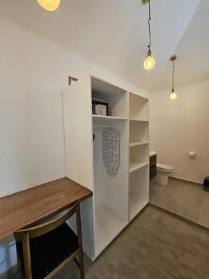 a room with a white cabinet and a table at Casa Shambala B&B in Las Terrenas