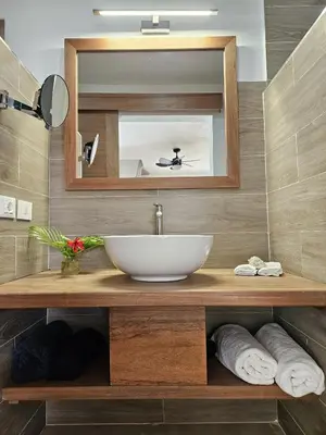 a bathroom with a sink and a mirror at Casa Shambala B&B in Las Terrenas