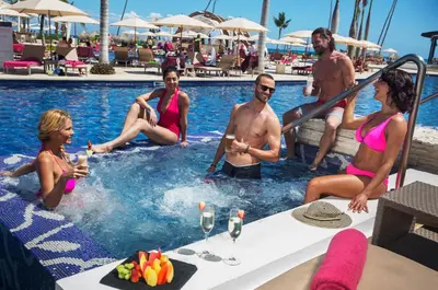 a group of people in the pool at a resort at Royalton CHIC Punta Cana, An Autograph Collection All-Inclusive Resort & Casino, Adults Only in Punta Cana