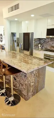 a kitchen with a granite counter top in a room at SEAWINDS CABARETE Front beach Condo in Cabarete
