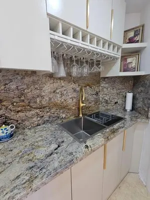 a kitchen with a sink and a counter top at SEAWINDS CABARETE Front beach Condo in Cabarete