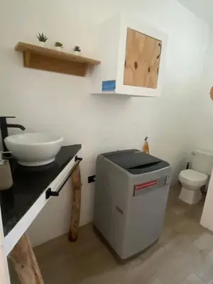 a bathroom with a sink and a toilet and a counter at Portitxol, fantástico apartamento in Bayahibe