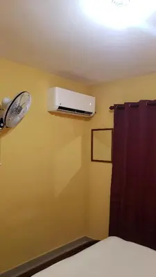 a room with a air conditioner on the wall at Petite Lounge in Los Paredones
