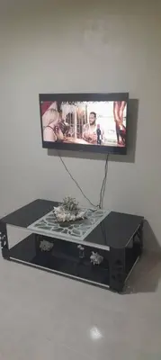 a flat screen tv sitting on top of a table at SDQ Apartamento Marbella 2 in La Ureña