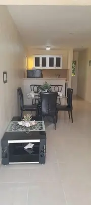 a living room with black chairs and a table at SDQ Apartamento Marbella 2 in La Ureña