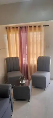 two chairs and a coffee table in a living room at SDQ Apartamento Marbella 2 in La Ureña