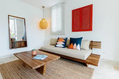 a living room with a couch and a table at Las Canas Beach Retreat in Gaspar Hernández