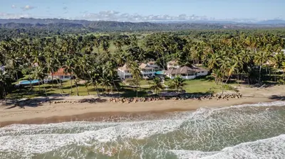 an aerial view of a resort with palm trees at Las Canas Beach Retreat in Gaspar Hernández