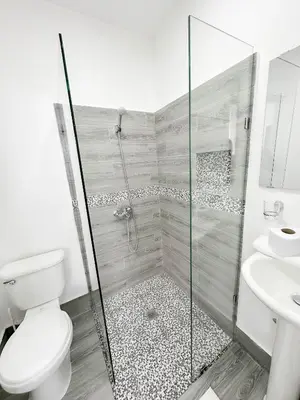 a bathroom with a shower and a toilet and a sink at La Yarolina in Punta Cana