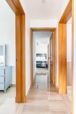 a hallway with two open doors to a kitchen at Luxurious 2BDR with Ocean View in Santo Domingo