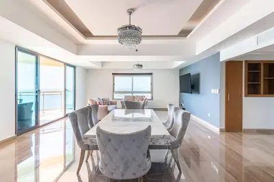 a dining room with a table and chairs at Luxurious 2BDR with Ocean View in Santo Domingo