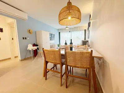 a kitchen and dining room with a table and chairs at Tropical Relaxing 2 Bedroom Unit with picuzzi in Punta Cana